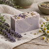 Lavender and chamomile soap bar with pressed flower petals on linen